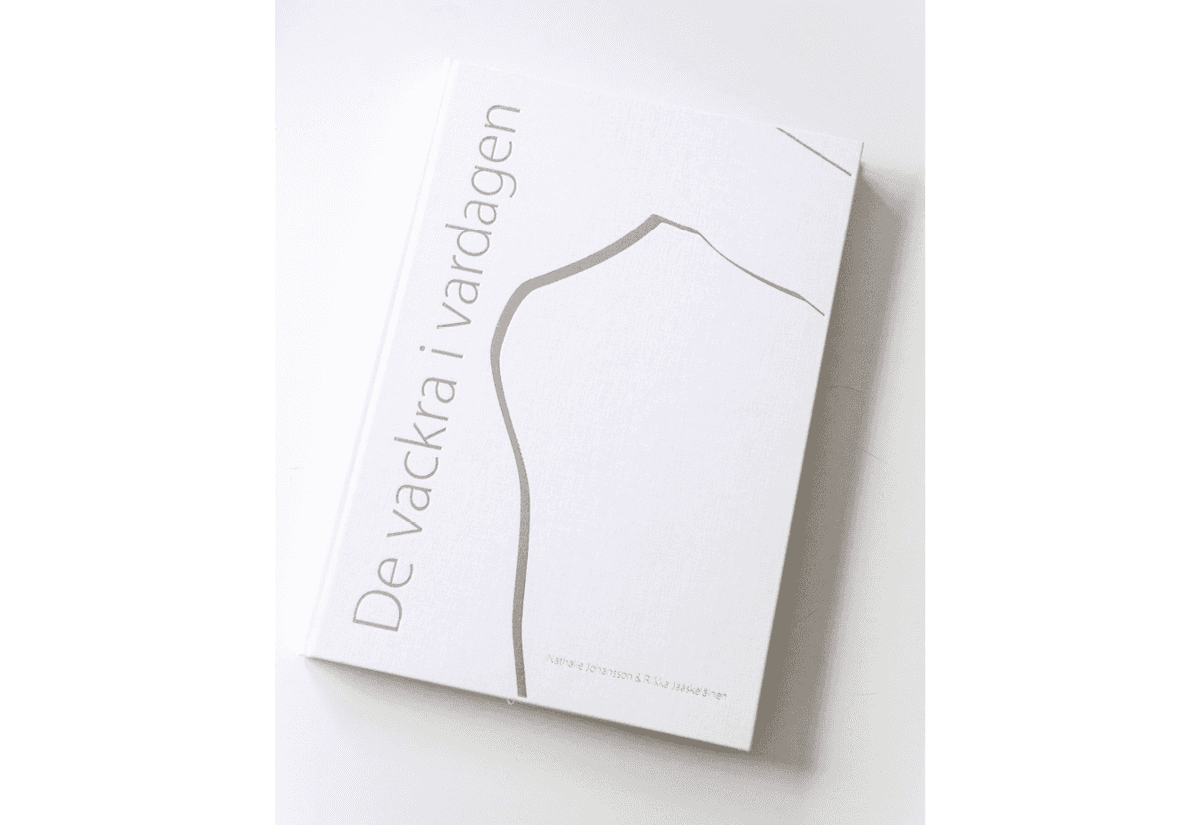 Uppslag från fotoboken De vackra i vardagen.